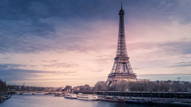 Eiffel Tower and the Seine in Paris at dusk, cover for our France golden visa guides