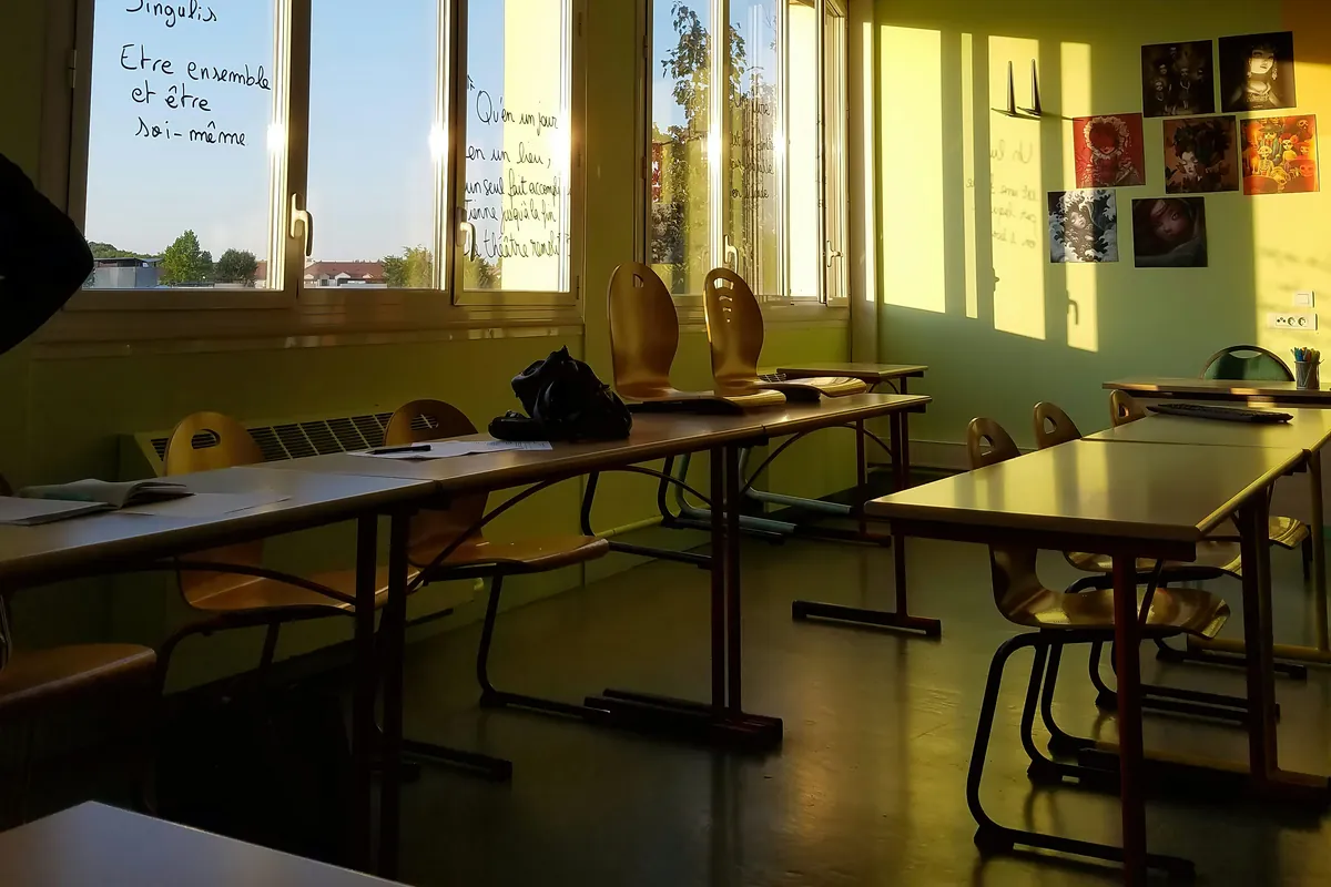 Empty French school classroom with desks, ready for dependent children in France